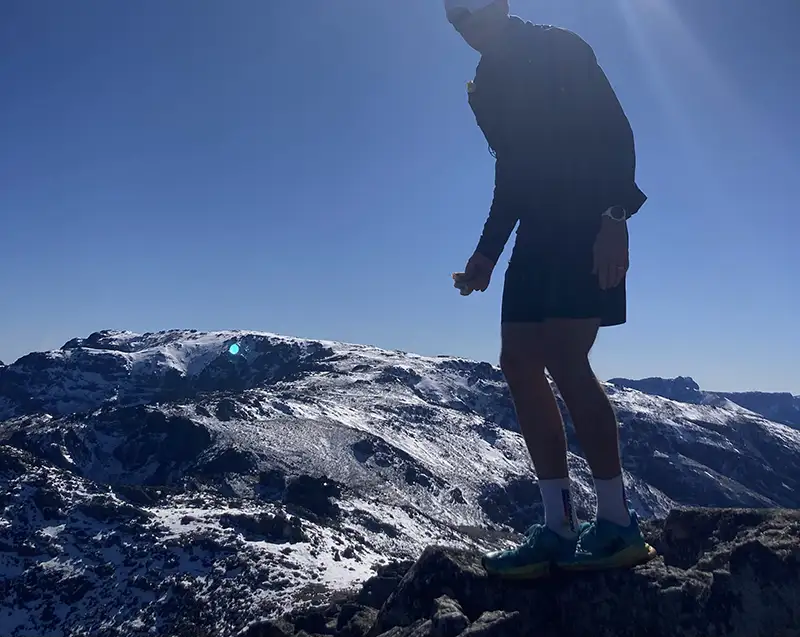 Trail Runner on the summit of a mountain